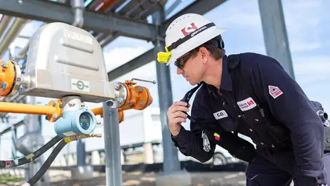 Operator checking meters and reporting on radio resized